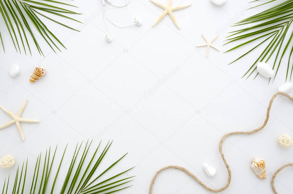 Summer Frame with a starfish, ropes, shells and palm leaves