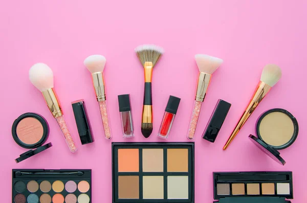 Professional decorative cosmetics, makeup tools on pink background. Flat composition beauty, fashion. top view — Stock Photo, Image