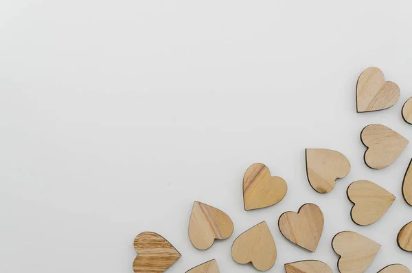 Corazones de madera en la esquina. Marco con espacio de copia. Textura vista superior — Foto de Stock