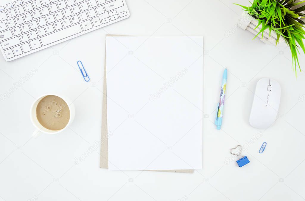 Bloggers workplace mockup with keyboard and mouse, blue supplies, cup of coffee and blank A4 paper list. Coffee break concept. Top view, flat lay with copy space