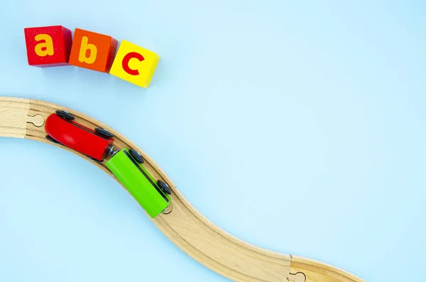 Top view Colorful wooden train road and cubes frame mockup. Flat lay A B C cubes, road and wooden train. Copy space for text