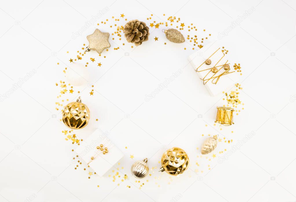 Flat lay mockup Christmas Round Frame made from gold Christmas Balls and decorations on white background. Space for text, winter holidays sale banner concept