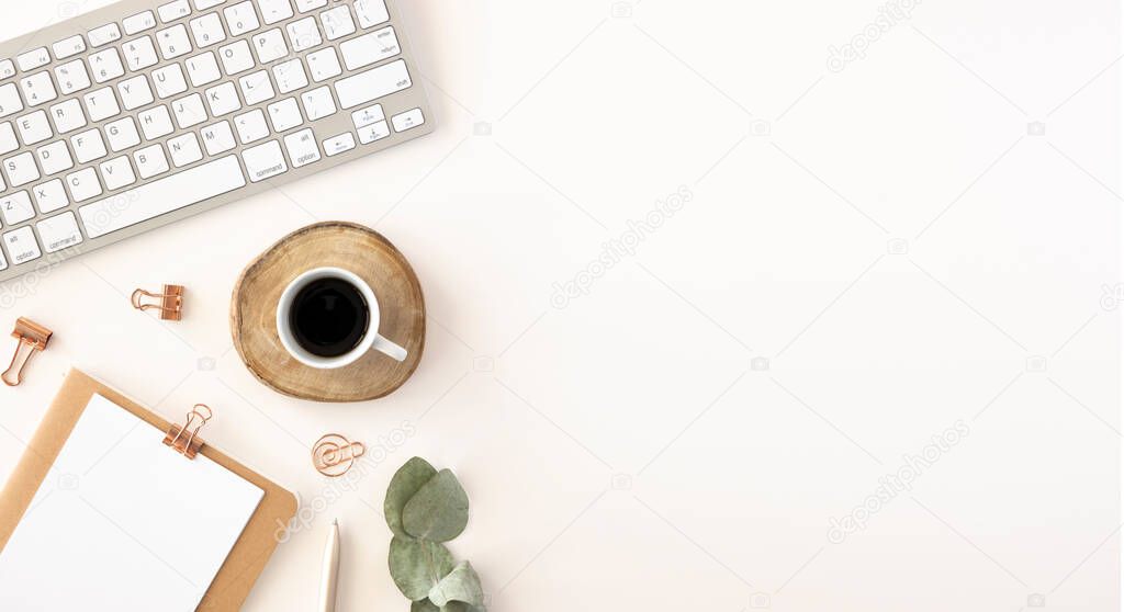 Minimal office workspace mockup with keyboard, clipboard and accessories. Flat lay with copy space