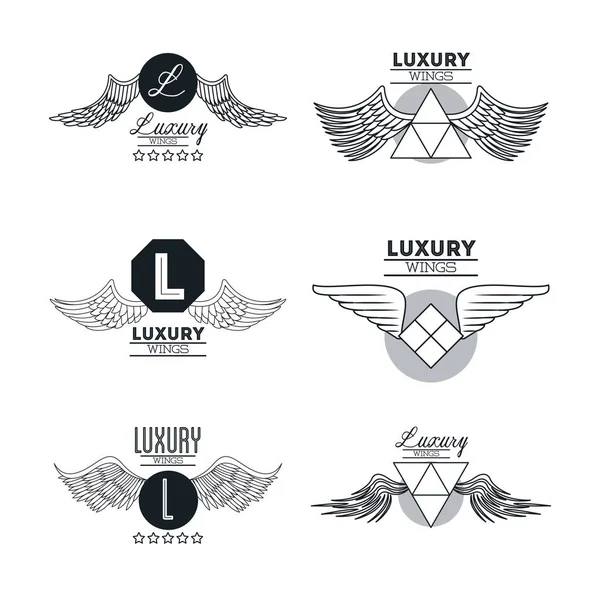 Set of luxury wings emblems — Stock Vector