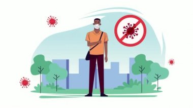 Parktaki kovid19 koruması için tıbbi maske takan genç adam.