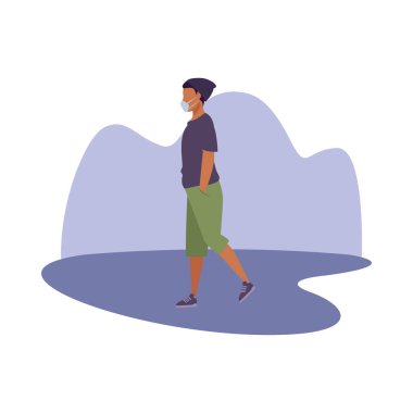 Tıbbi maske takan genç afro adam.