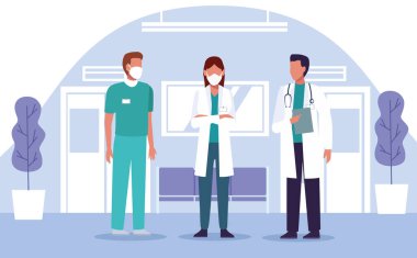 Bir grup doktor hastane yerinde tıbbi maske takıyor.