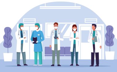 Bir grup doktor hastane yerinde tıbbi maske takıyor.
