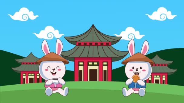 Mid autumn festival animation with rabbits drinking tea and eating cookies in the field — Stock Video