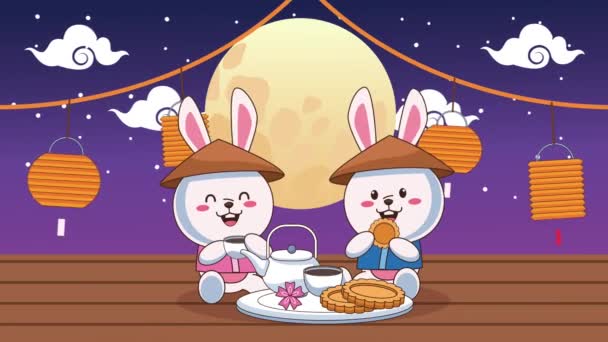 Sonbahar festivalinin ortasında tavşanların çay içip kurabiye yediği animasyon. — Stok video