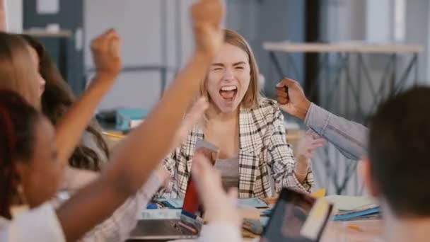 Happy young female company team leader celebrates business success, motivates multiethnic office team, falling confetti. — Stock Video