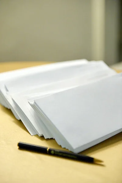 Envelopes with the handle on a table — Stock Photo, Image