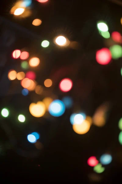 Schöne Bunte Bokeh Weihnachtsbeleuchtung Auf Schwarzem Hintergrund — Stockfoto