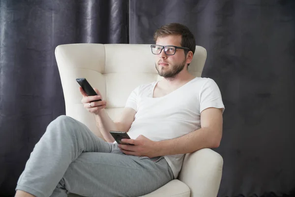 Man Holding Remote Control Watching Great Show Sitting Home — Stock Photo, Image
