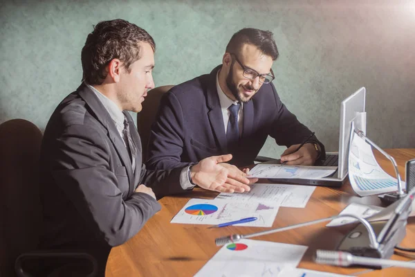 Image Two Young Businessmen Discussing Document Touchpad Meeting — Stock Photo, Image