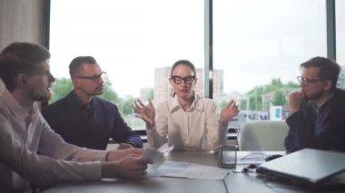 woman businessman leader at a meeting of businessmen in the office