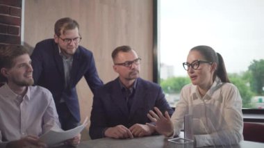 woman businessman leader at a meeting of businessmen in the office