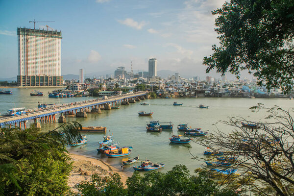 Vietnam, Nha Trang - March 20 2017 : Panoramic daytime view of Nha Trang city, popular tourist destination in Vietnam. Fishing boats in marina at Nha Trang, Vietnam