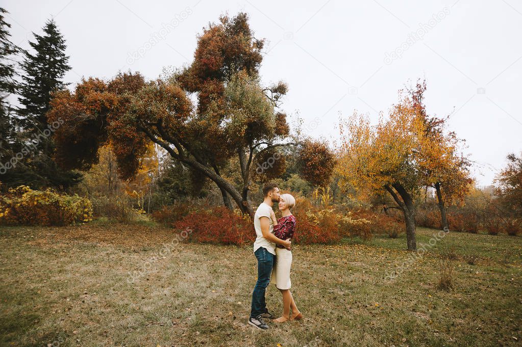 In love couple outdoor in park, autumn time