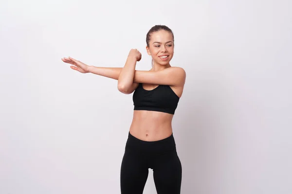 Joven Deportista Practicando Yoga Haciendo Ejercicio Sobre Fondo Blanco Pared —  Fotos de Stock