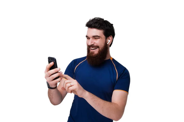 Handsome Bearded Man Sport Clothes Using Smartphone Smiling While Standing — Stock Photo, Image