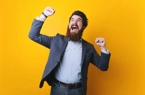 stock image Photo of happy businessman, stylish bearded man make winner gesture.