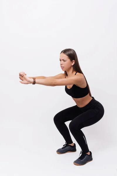 Attractive Young Sportswoman Sportwear Doing Squats Isolated White Backgroun — Stock Photo, Image