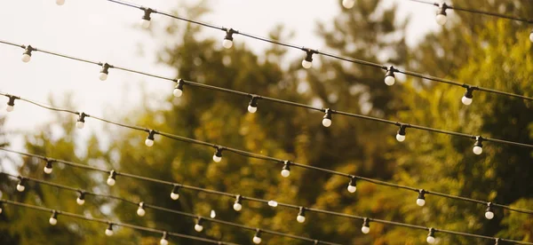 Hanging decorative lights for a wedding party day
