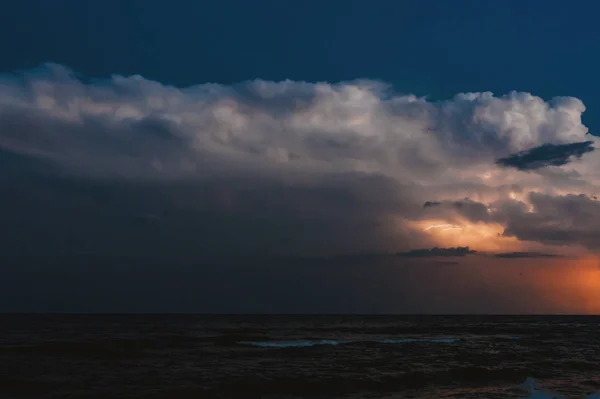 Photo of a dark clouds, sea storm, with lightning, beautiful sea landscape