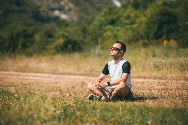 Young Man Meditating Green Grass Field Face Raised Sky Eyes — Stock Photo, Image