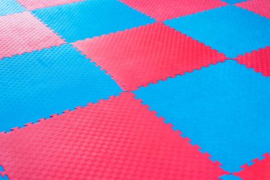 Dövüş sanatları için mavi ve kırmızı tatami sporunun arka planı