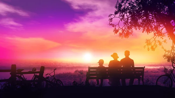 Familj på tre på en bänk vid solnedgången och en vacker utsikt över floden — Stockfoto