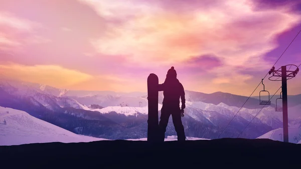 Snowboardista na pozadí západu slunce v horách. — Stock fotografie