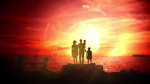 Egy család sziluettje a vörös naplemente hátterében. — Stock videók