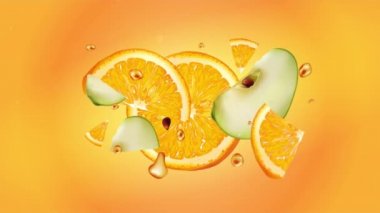 Elma ve portakal dilimleri yavaş çekimde uçar..