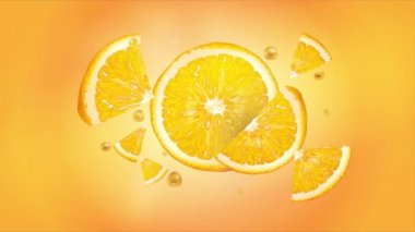 Ağır çekimde uçarken portakal dilimleri.