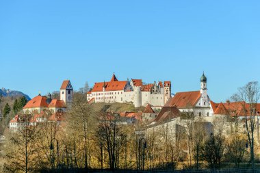 Fussen, Germany - FEBRUARY 12, 2016: Bavarian town just north of the Austrian border.  Known for its Hohes Schloss Fussen. clipart