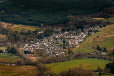 View of the village of Killin in Scotland at dusk from the Tarmachan ridge. clipart