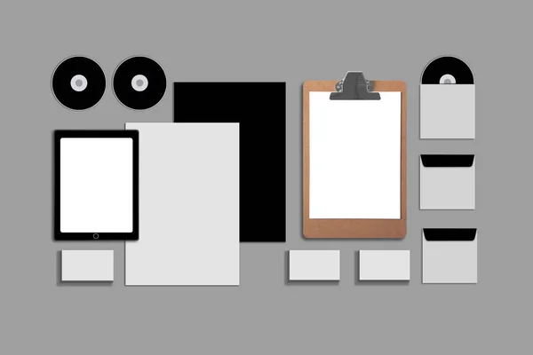 空白公司 Id. 设置为灰色背景。包括名片、文件夹、平板电脑、信封、a4 信纸、笔记本、闪存、铅笔、cd 盘和智能手机. — 图库照片