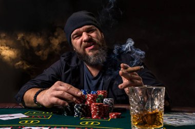 Man is playing poker. Emotional fail in game, game over for card player, man very angry with foolish choices, losing all the chips on bank. clipart