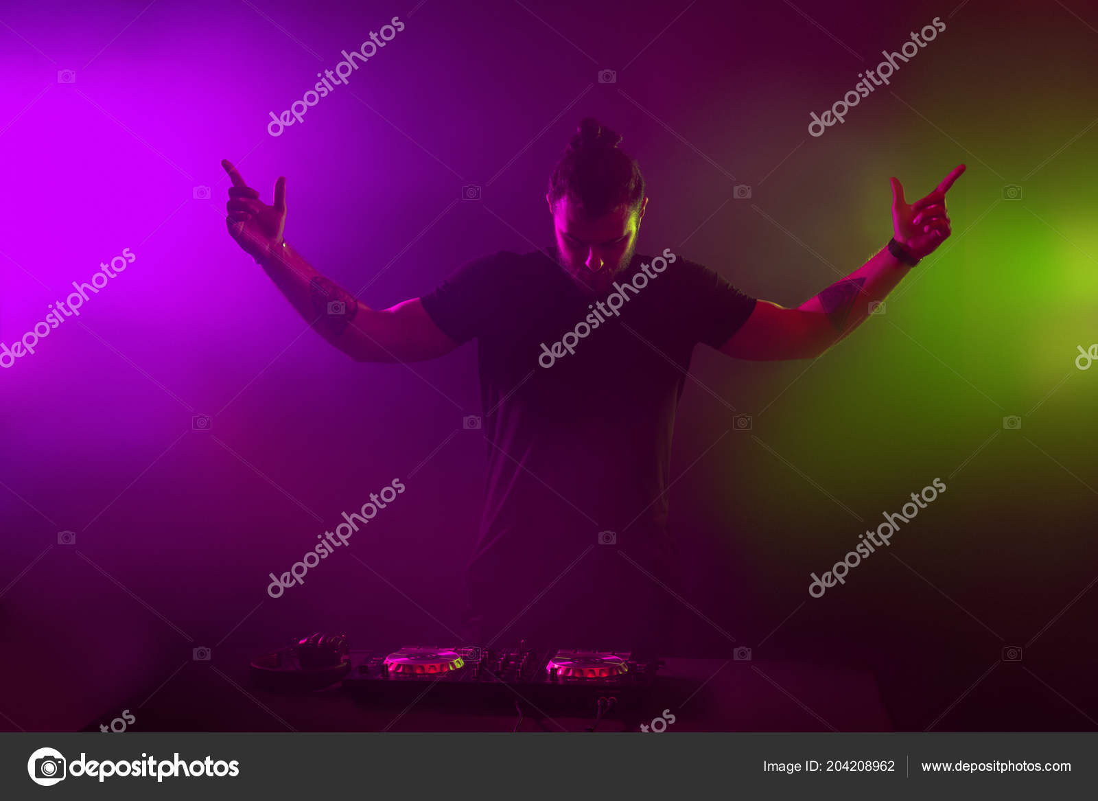 DJ at work mixing sound on her decks at a party or night club with  colourful smoke light background Stock Photo by ©@  204208962