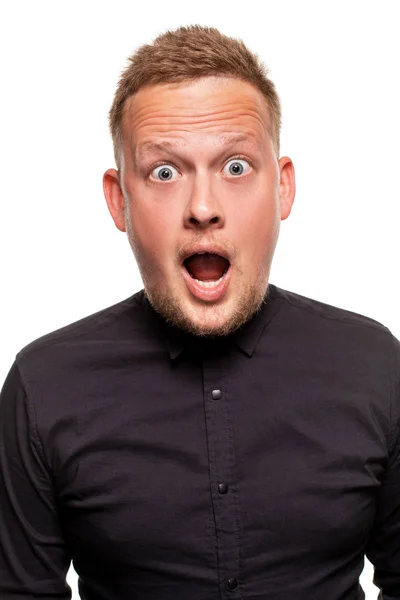 Vertical shot of stupefied stunned shocked young male keeps mouth widely opened, being surprised and very emotional, expresses great surprisment. — Stock Photo, Image