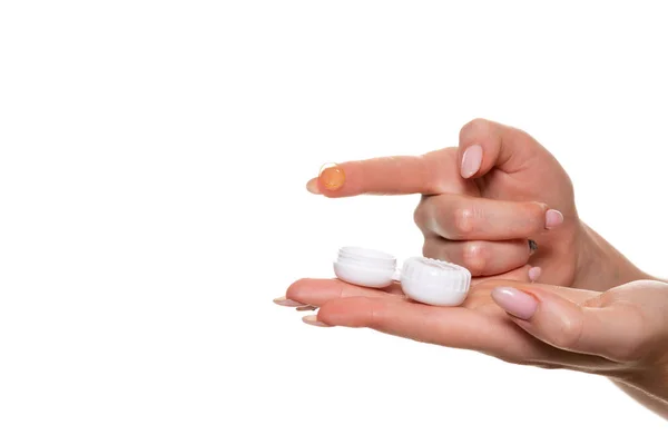 Contact eye lens. Close-up of woman hands holding white eyelense container. — Stock Photo, Image