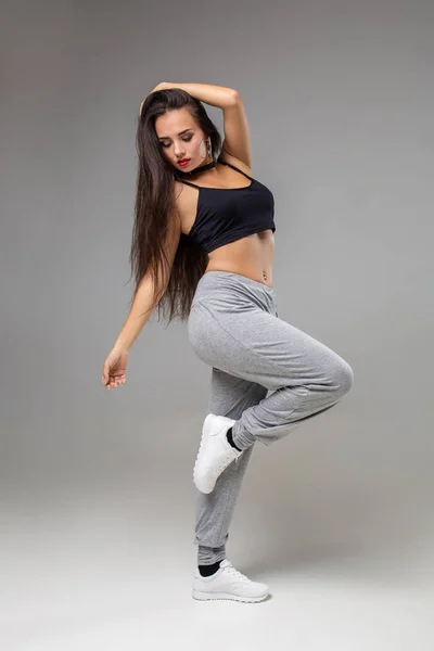 Brunette Girl with a Slim Figure in Leggings Posing in Studio on a Black  Background Stock Image - Image of healthy, business: 159555749