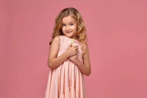 Lovely Little Girl Blond Curly Hair Pink Dress Posing Candy — Stock Photo, Image