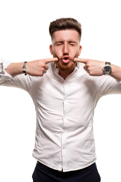 Foto del estudio de un hombre guapo con una camisa blanca, aislado sobre un fondo blanco —  Fotos de Stock