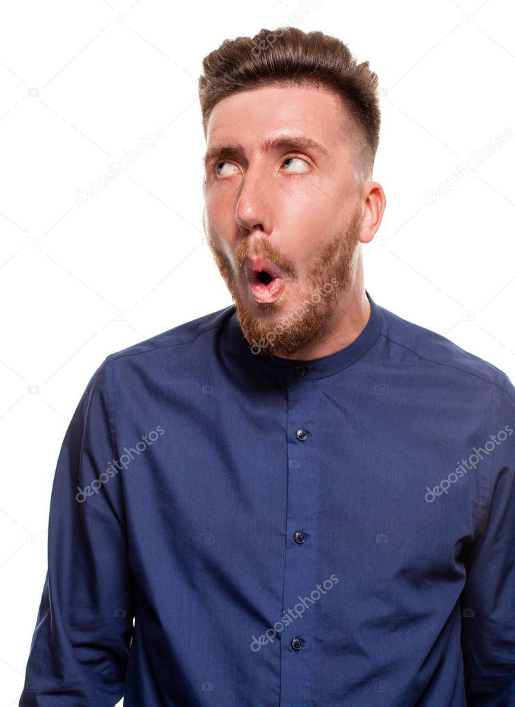 Attractive young man wearing blue shirt, isolated over a white background.