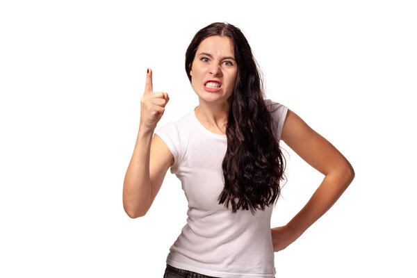 Angry young girl threatening with a finger
