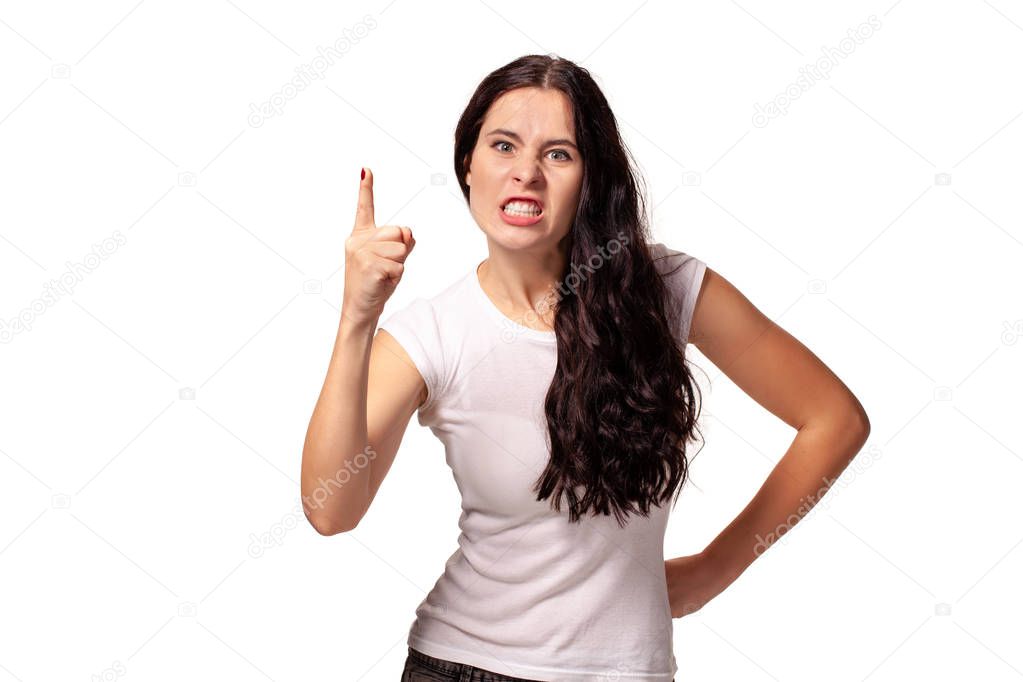 Angry young girl threatening with a finger