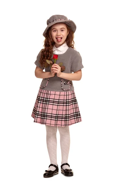 Full length shot of a lovely little kid with a long, curly hair posing isolated on white background. — Stock Photo, Image